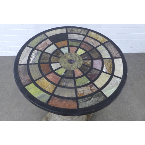 282 - Garden table with Italian specimen marble style circular top, on a stone column base,  61 x 78cm.