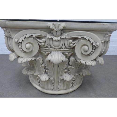 285 - A large corinthian column capital, cast in resin and formed as a table base with a removable circula... 