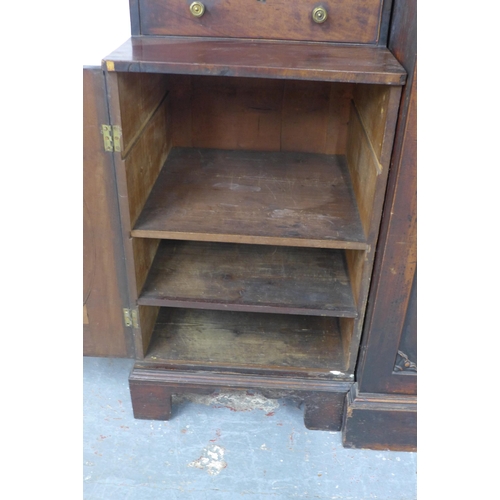 291 - 19th century mahogany breakfront library bookcase, the top of one cupboard door stamped Gillows Lanc... 