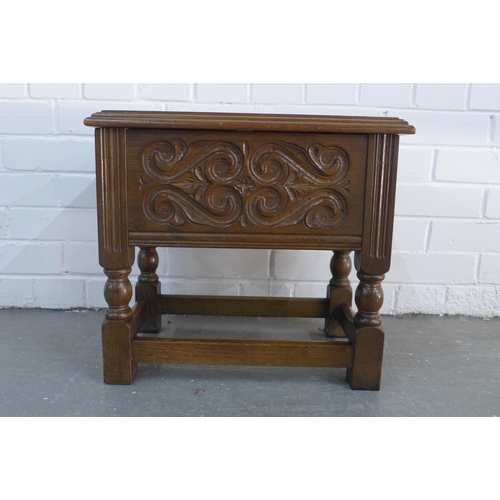 300 - Oak stool, with lift up lid for storage, and carved side panels, 44 x 40 x 30cm