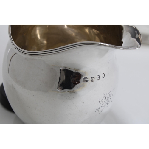 42 - Georgian silver cream jug, London 1805 together with a late silver sugar bowl, London 1917 (2)