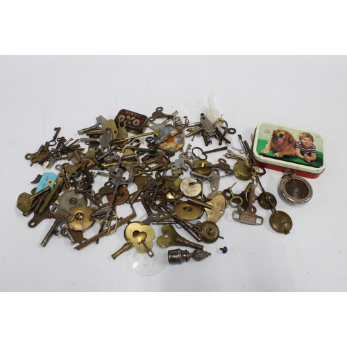 421 - Collection of clock and watch keys, some pendulums and other spare parts, etc