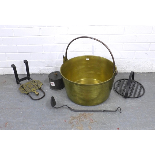 433 - Large brass jelly pan, 41 x 22cm excluding handle, together with a pewter canister, two cast iron im... 