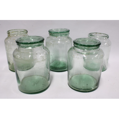 438 - Five large vintage green glass storage jars, three with covers, 22cm (5)