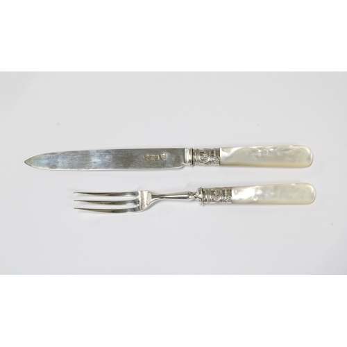 44 - An Edwardian oak canteen of silver and mother of pearl fruit knives and forks, 12 place setting but ... 