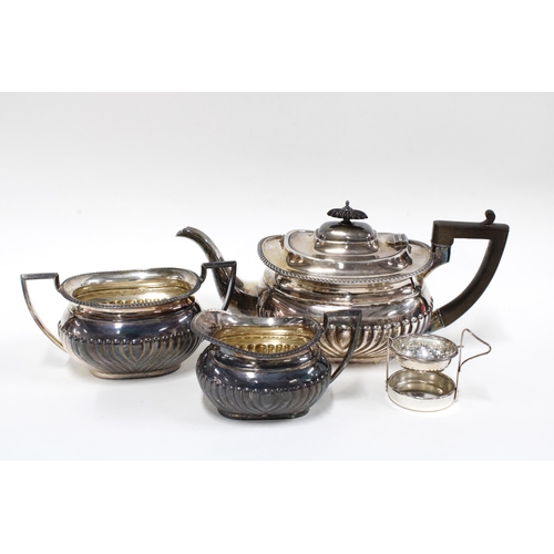 47 - An Edwardian silver teaset, Sheffield 1907, and an Epns tea strainer (4)