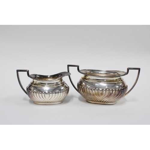 47 - An Edwardian silver teaset, Sheffield 1907, and an Epns tea strainer (4)