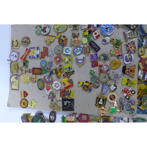 485 - A large collection of vintage enamel and metal lapel and pin badges