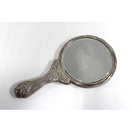 59 - An Art Nouveau silver backed hand mirror, Chester 1906, 28cm