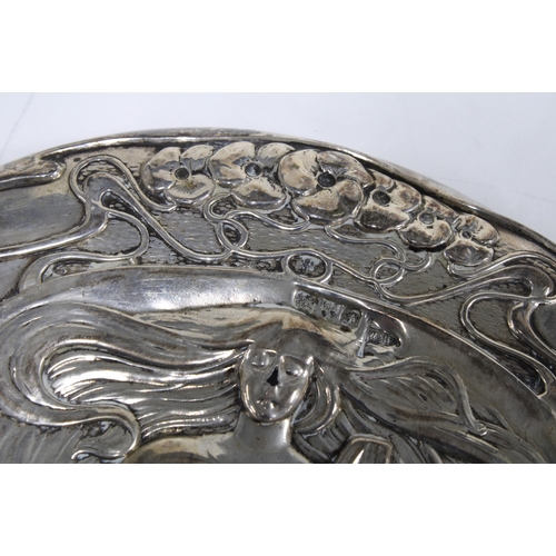 59 - An Art Nouveau silver backed hand mirror, Chester 1906, 28cm