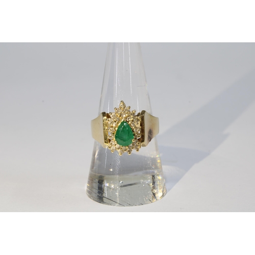 61 - A 14ct gold emerald and diamond cluster ring, stamped 585, size P