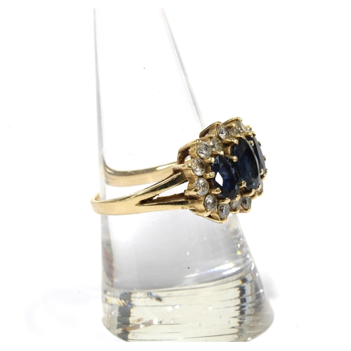 63 - Sapphire and diamond dress ring, claw set with three sapphires within a surround of smaller diamonds... 