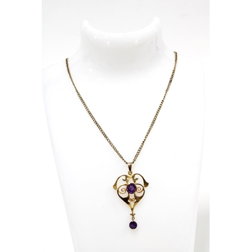 64 - An Edwardian 9ct gold & amethyst pendant on a 9ct gold chain, pendant and chain stamped 9ct