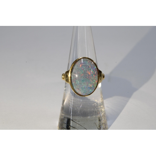 71 - 14ct gold doublet opal ring, stamped 14K, size K