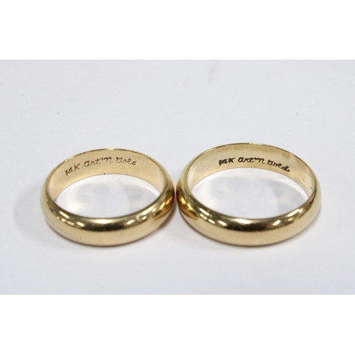 73 - Two 14ct gold wedding bands, each stamped 14k and signed art n' gold (2)