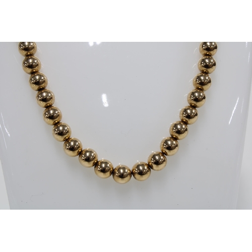 78 - 14ct gold bead necklace, clasp stamped 14k