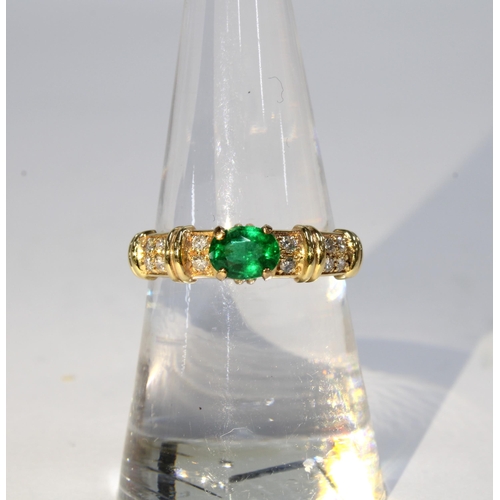 84 - 14ct gold emerald and diamond ring, the central claw set emerald flanked by six smaller diamonds, st... 