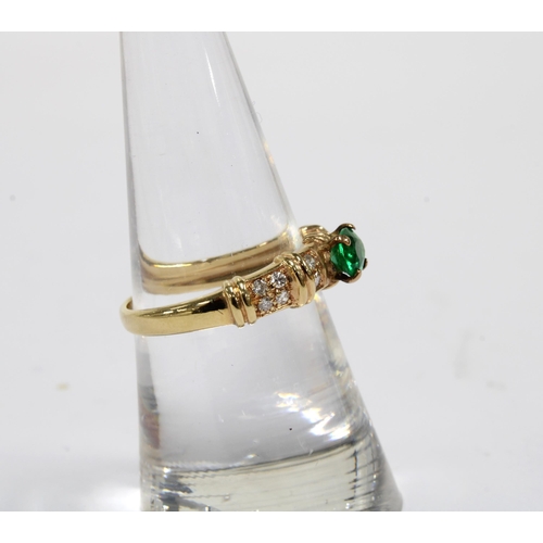 84 - 14ct gold emerald and diamond ring, the central claw set emerald flanked by six smaller diamonds, st... 