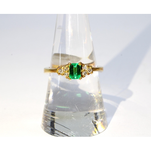 87 - 18ct gold emerald and diamond ring, with a baguette cut emerald flanked by diamonds, stamped 18k, si... 