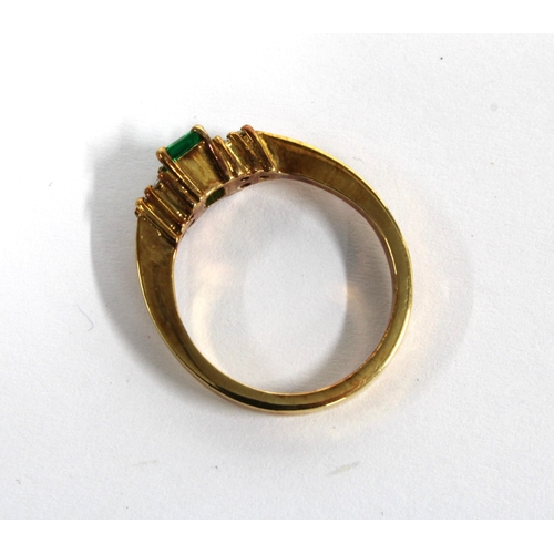 87 - 18ct gold emerald and diamond ring, with a baguette cut emerald flanked by diamonds, stamped 18k, si... 