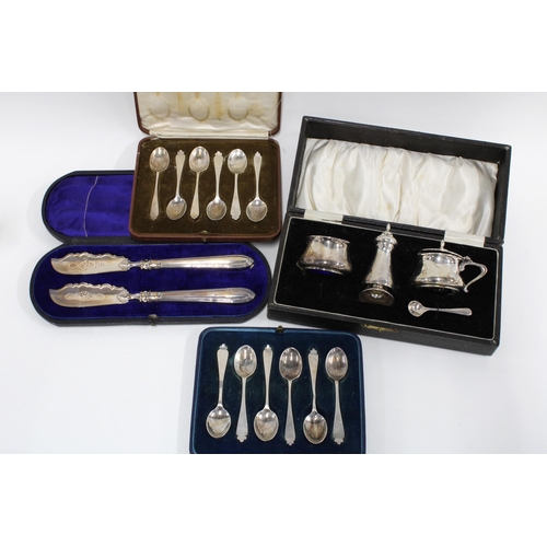 100 - Two cased sets of six silver teaspoons, Victorian cased set of two silver butter knives and a three ... 