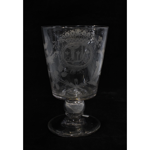 128 - A large early 19th century goblet with a 1787 coin in the stem, with etched monogram J.M.C 1830 surr... 