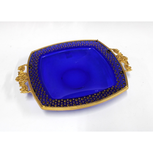 140 - Cobalt blue glass dish with gilt metal mount and handles, 33 x 27cm