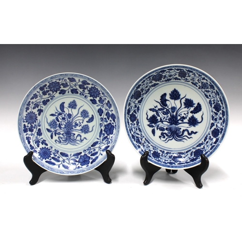 144 - Two Chinese blue and white lotus flower plates, bearing Yongzheng marks within double circle but lik... 