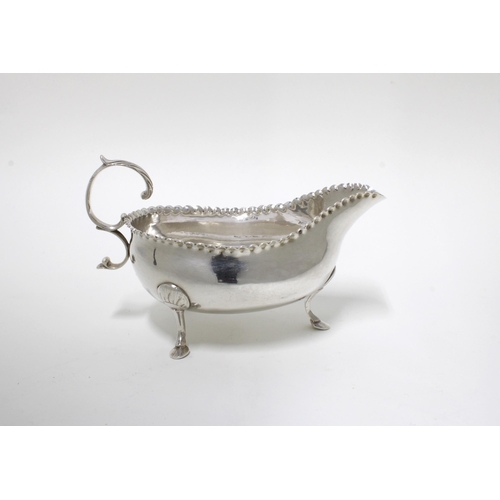 20 - George III silver sauceboat with pinched rim, raised on three hoof feet, David Crawford, Newcastle 1... 