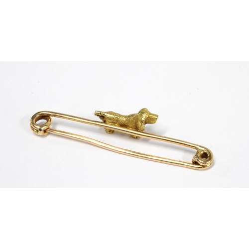 24 - Early to mid 20th century yellow metal dog bar brooch, unmarked, 5.2cm long