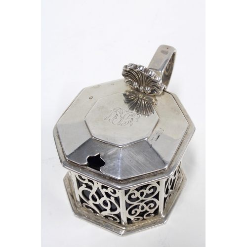 28 - Victorian silver mustard pot, of hexagonal outline with pierced panels and a blue glass liner, Reily... 