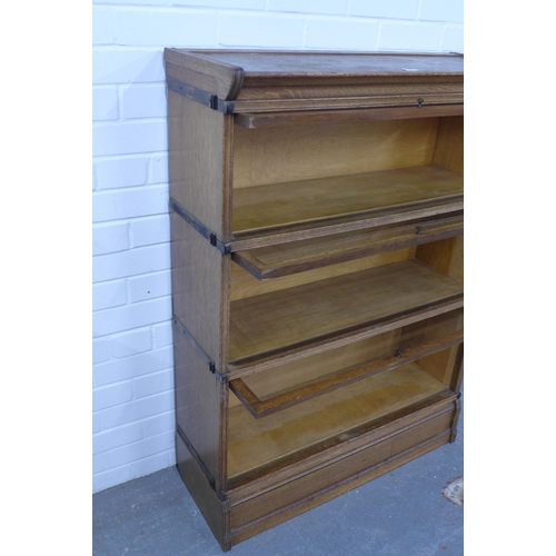 281 - Inglesants oak three tier sectional bookcase, with glass fronts and brass label, 87 x 120 x 31cm