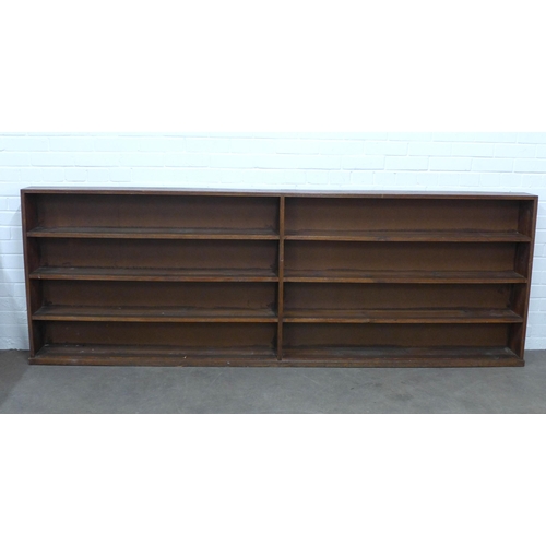 294 - Early 20th century open bookcase, long narrow proportions, the shelving adequate for Penguin sized p... 