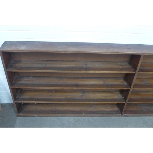 294 - Early 20th century open bookcase, long narrow proportions, the shelving adequate for Penguin sized p... 