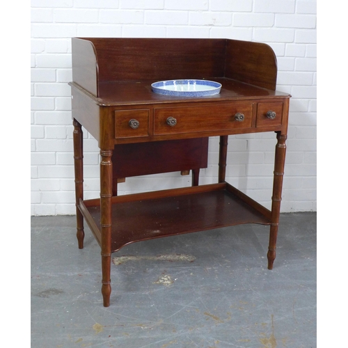 297 - Early 19th century mahogany washstand, sliding mirror, undertier and on ring turned legs, with a blu... 