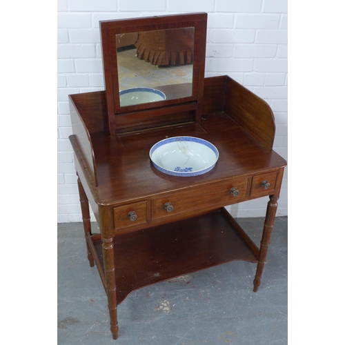 297 - Early 19th century mahogany washstand, sliding mirror, undertier and on ring turned legs, with a blu... 