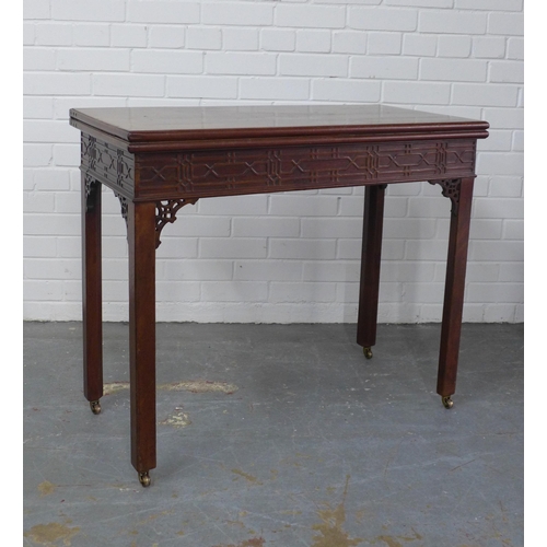 299 - George III Chippendale style mahogany table, the fold over top with blind fret carved frieze, on squ... 