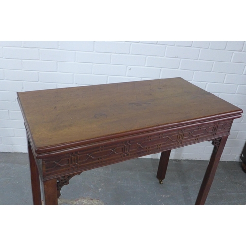 299 - George III Chippendale style mahogany table, the fold over top with blind fret carved frieze, on squ... 