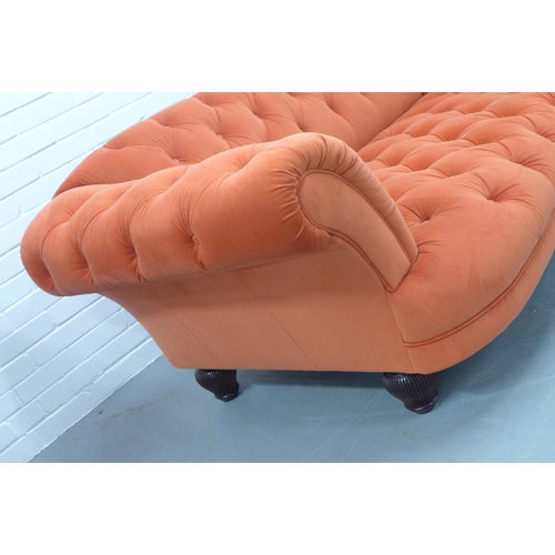 311 - Contemporary Chesterfield scroll arm settee, orange velvet buttonback upholstery, fluted wooden legs... 