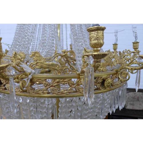 314 - A large glass and gilt metal tent and bag chandelier, 94 x 145cm (approx) (a/f some losses)