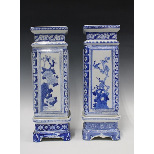 345 - A pair of Chinese blue and white square  vases on stands, 42cm (2)