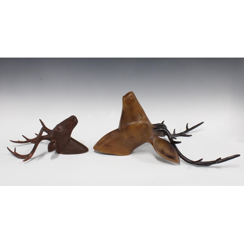 353 - A modern painted metal deer head, 34 x 48cm, together with a smaller brown painted composite deer he... 