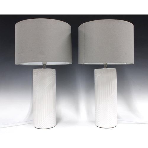 367 - A pair of contemporary textured pottery table lamps, 36cm to fitting, with grey shades (2)