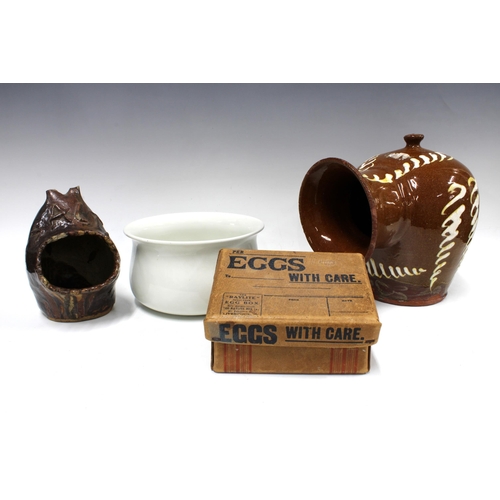 380 - A large slipware salt jar, 27cm, together with another smaller, a chamber pot, and a vintage cardboa... 