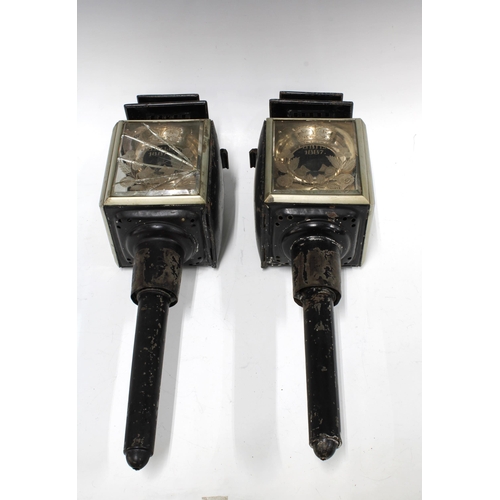 385 - Pair of Victorian VR Jubilee 1887 black metal and glass panelled carriage lanterns, one with the gla... 