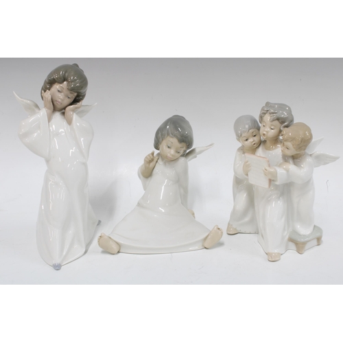 388 - Two Lladro angels and an angel figure group, tallest 22cm (3)