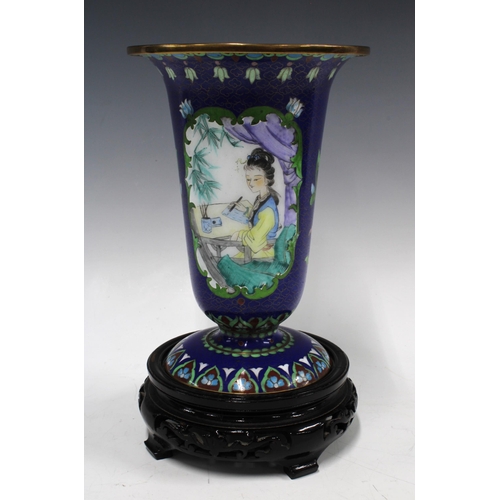 402 - Cloisonne vase with painted panels on a blue field, on wooden stand, 26cm