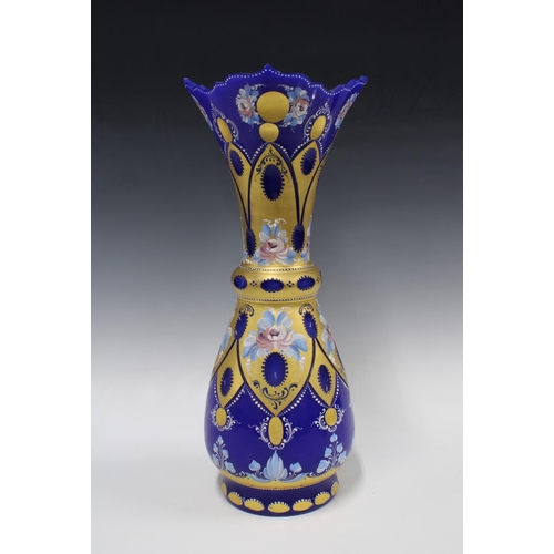 412 - A large Murano Venetian cobalt blue glass vase decorated with gilt and painted flowers, 47cm