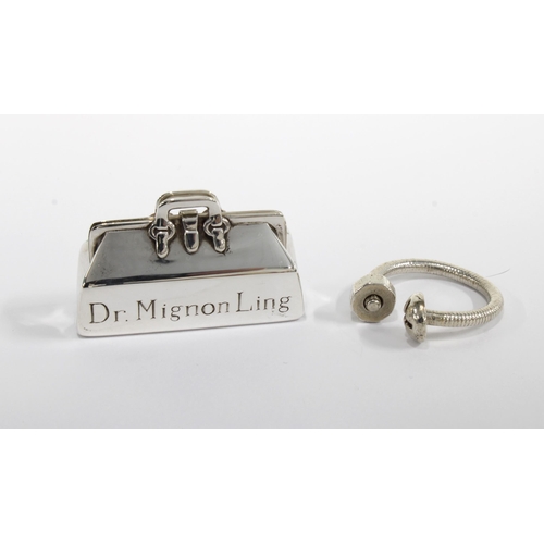 60 - Tiffany silver keyring and a tiffany silver pill box in the form of a Doctor's bag, both with origin... 