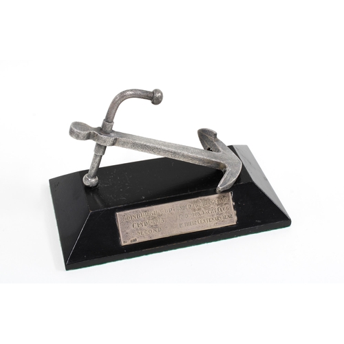 68 - Silver anchor with a textured finish, Edinburgh 1972, on an ebonised presentation stand, 14cm long